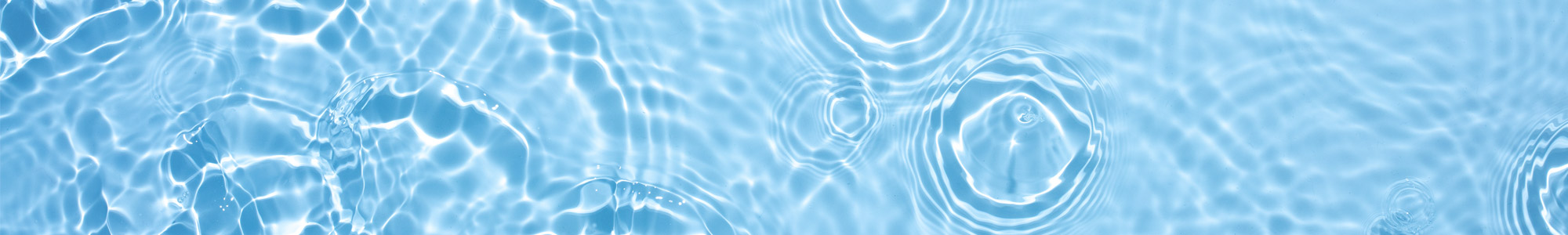 water with droplet circles spreading across the surface